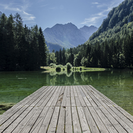 A dock on a beautiful mountain pond