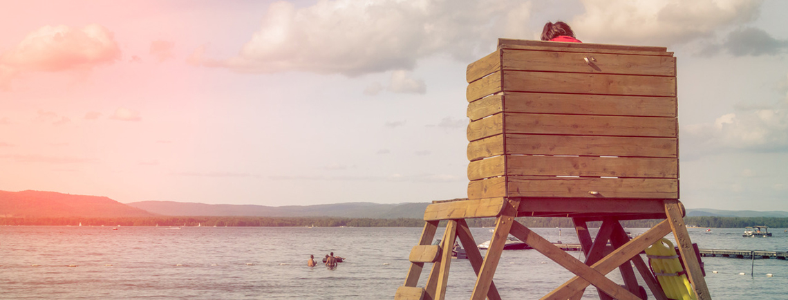 Lifeguard both by the lake.